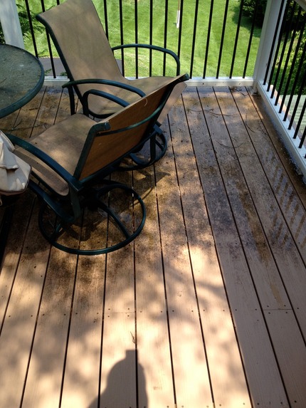 Marc’s on the Glass composite deck cleaning with pressure washer, deck with black stains in greater richmond va