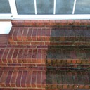 Marc’s on the Glass power pressure washing brick with mold and moss in richmond, va